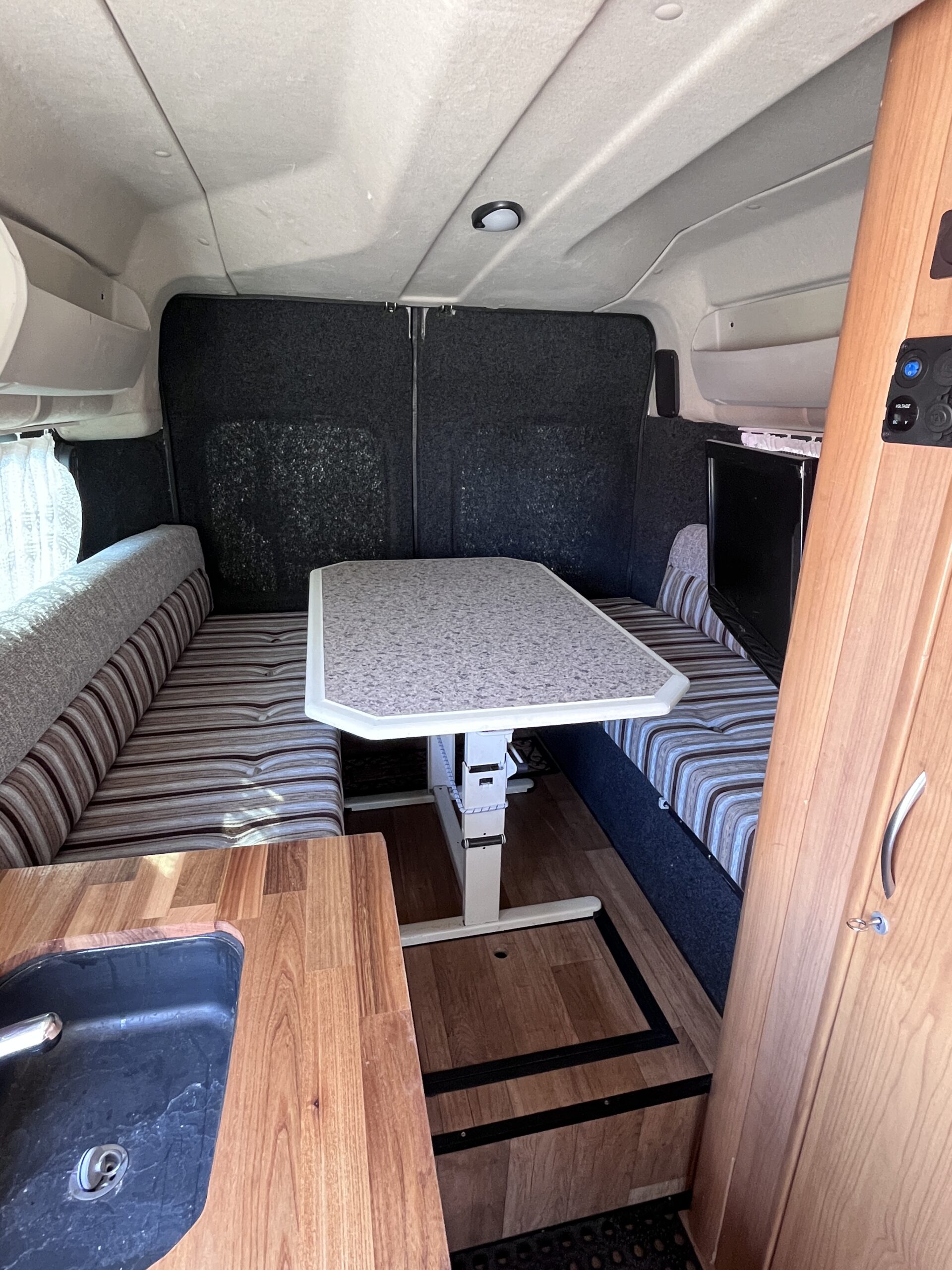 Peugeot Boxer 2014 campervan interior – dining area and kitchen