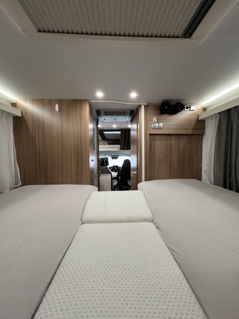 Adria Coral XL 670 rear bed and living area