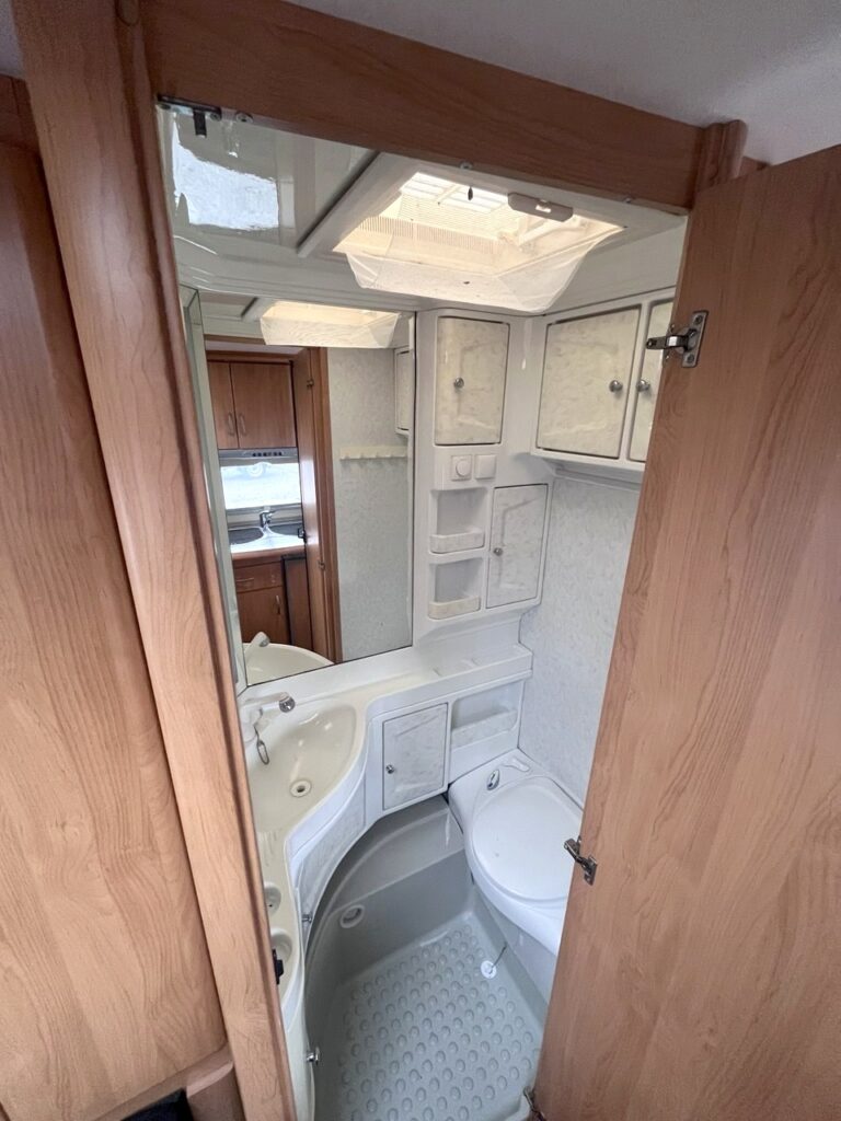 Hobby caravan bathroom with toilet, sink and shower tray